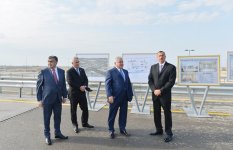 İlham Əliyev Zığ dairəsi - Heydər Əliyev Beynəlxalq Aeroportu avtomagistralının 13-cü km-liyindən Qala qəsəbəsinə gedən yolun açılışında iştirak edib (FOTO)