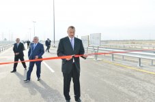 İlham Əliyev Zığ dairəsi - Heydər Əliyev Beynəlxalq Aeroportu avtomagistralının 13-cü km-liyindən Qala qəsəbəsinə gedən yolun açılışında iştirak edib (FOTO)