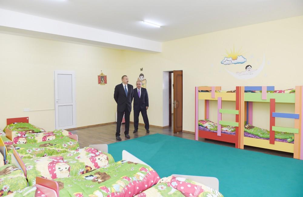 Prezident İlham Əliyev Qobustanda yeni tikilmiş 100 yerlik uşaq bağçasının açılışında iştirak edib (YENİLƏNİB) (FOTO)