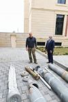 Prezident İlham Əliyev Ermənistan tərəfindən Tərtərə atılmış mərmilərə baxıb (FOTO)