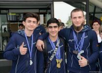 Avropa Çempionatında medallar qazanmış gimnastlar Azərbaycana qayıdıb (FOTO)