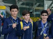 Avropa Çempionatında medallar qazanmış gimnastlar Azərbaycana qayıdıb (FOTO)